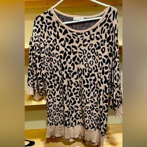 Large cheetah print quarter sleeve sweater like shirt.